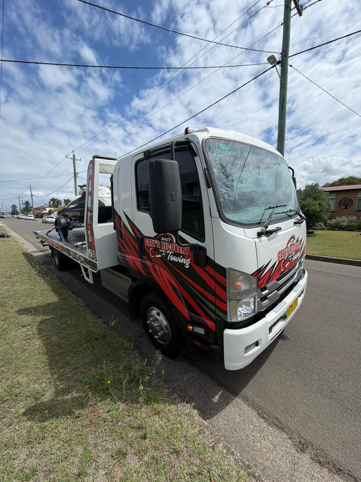 Gary's tow truck in rural setting