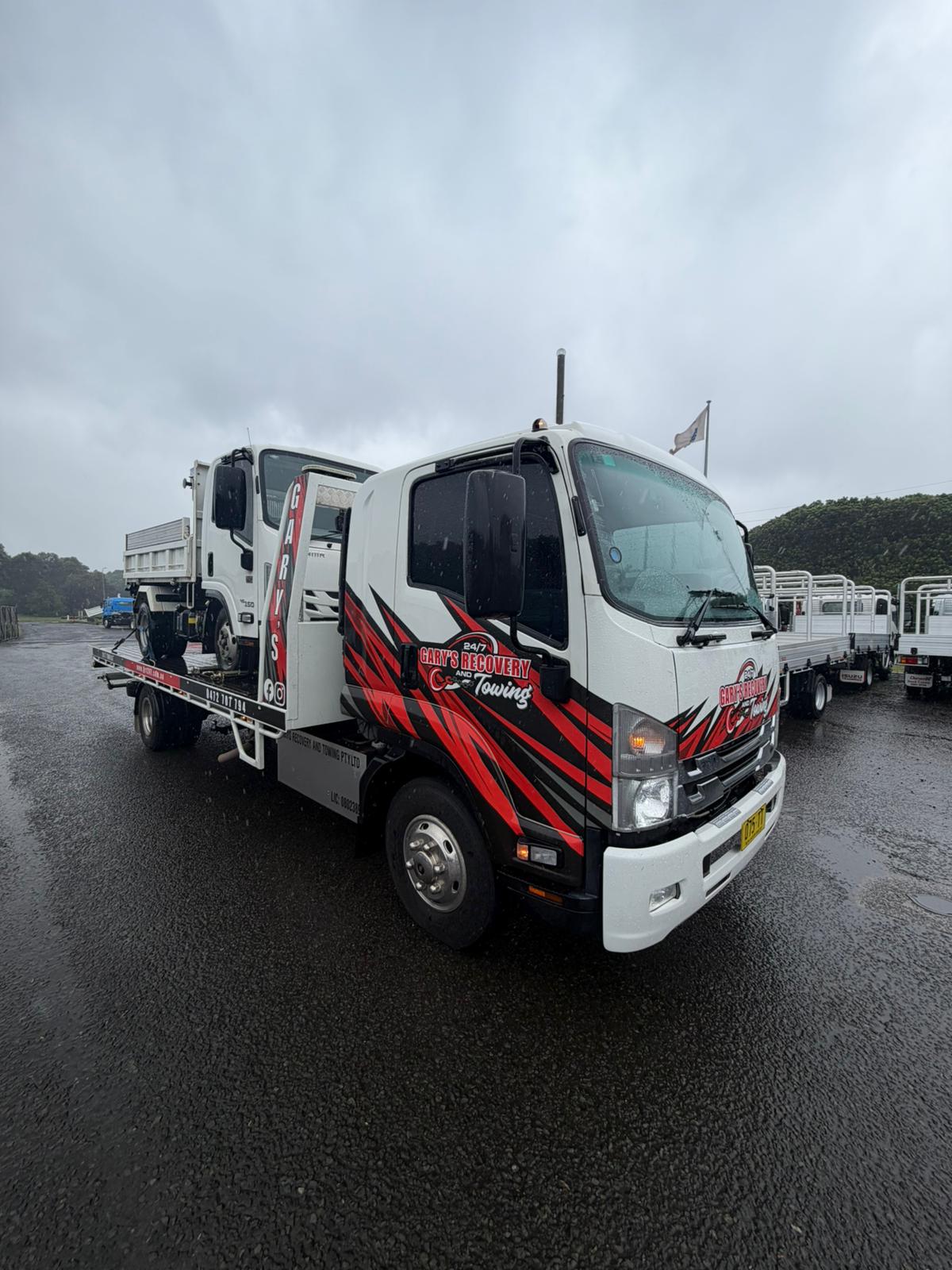 Gary's tow truck carrying a vehicle